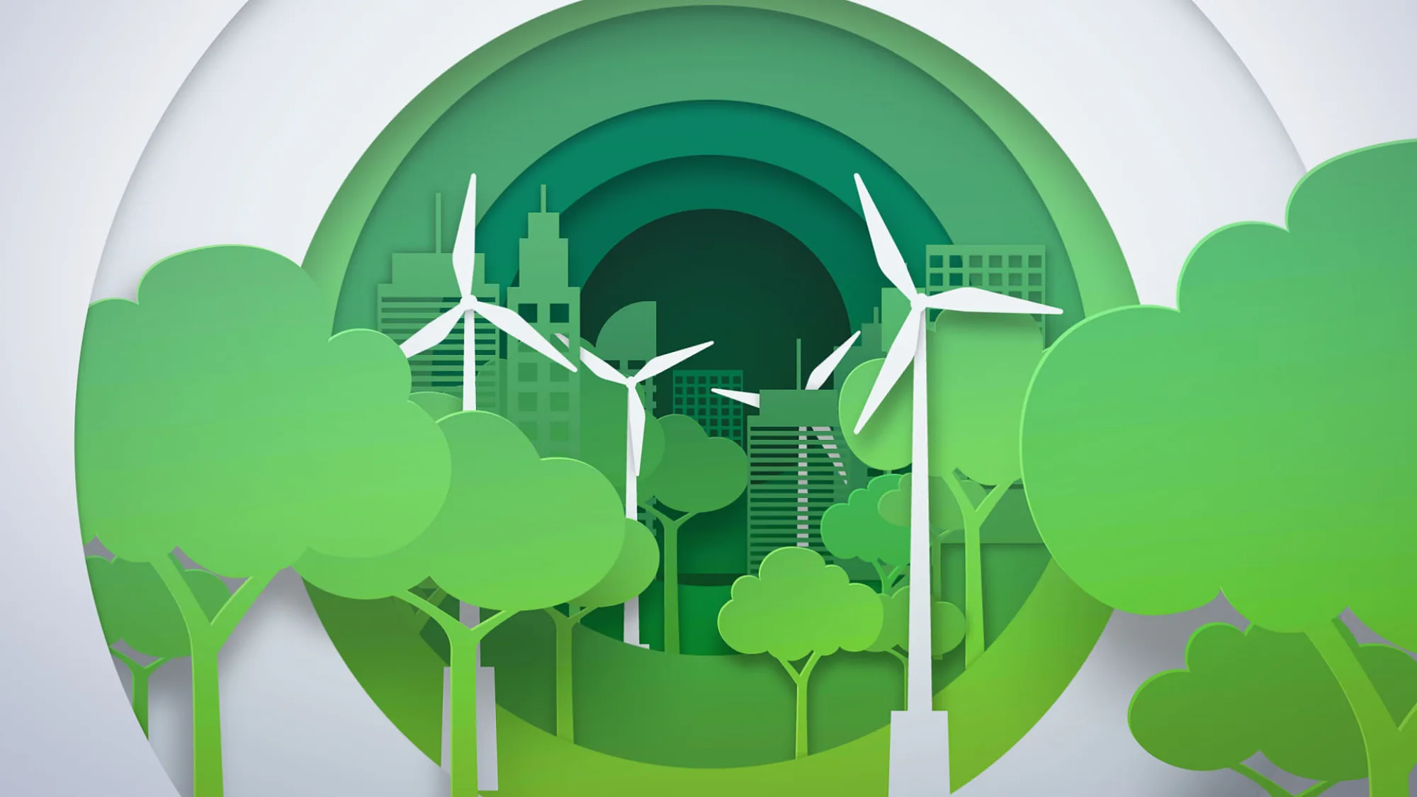 Zero Carbon city with green buildings and trees in the foreground as a layered still