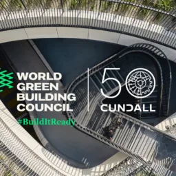 Aerial view of a curved stairway and landscaped walkway with World Green Building Council and Cundall 50 anniversary branding overlay.