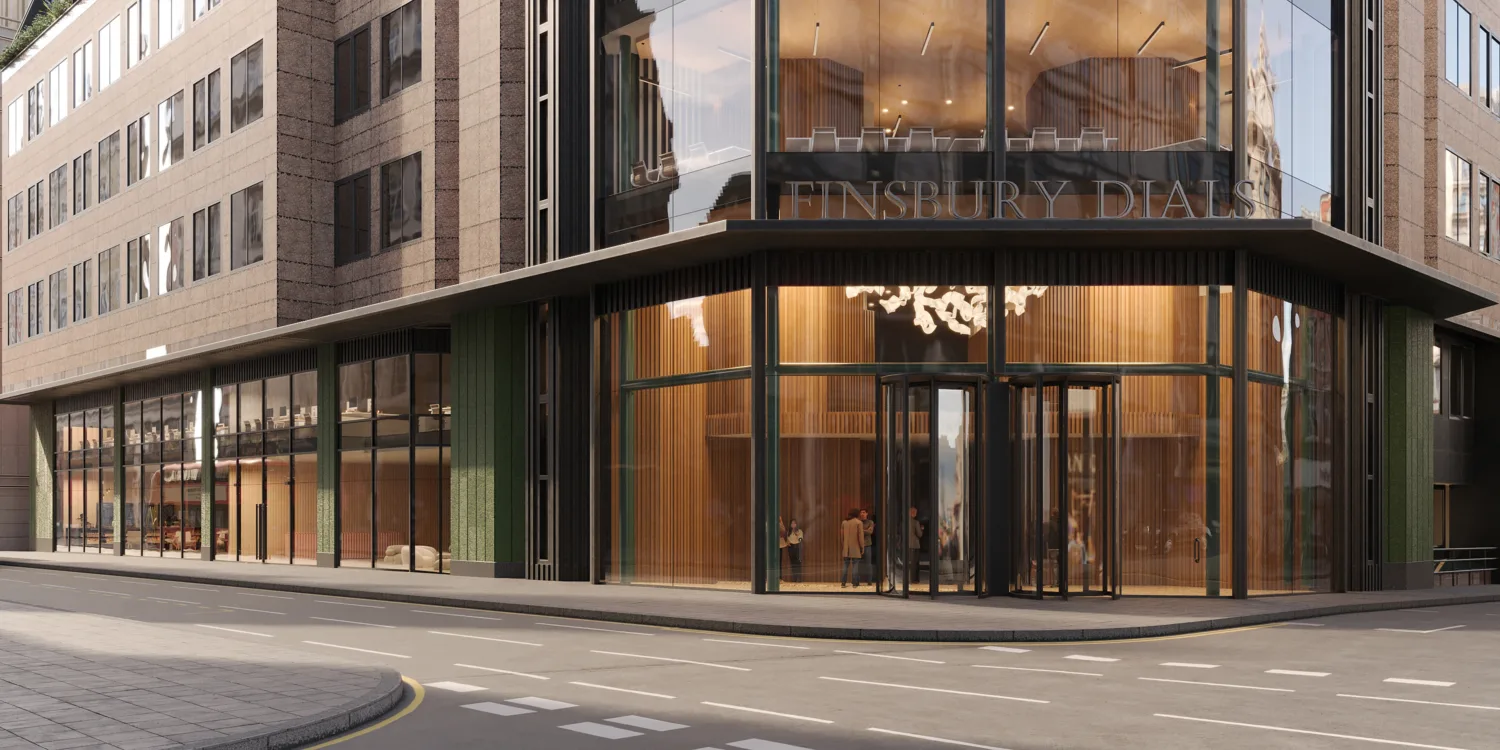 Street corner commercial building with glazed entrance, upper floor windows and visible Finsbury Dials signage.