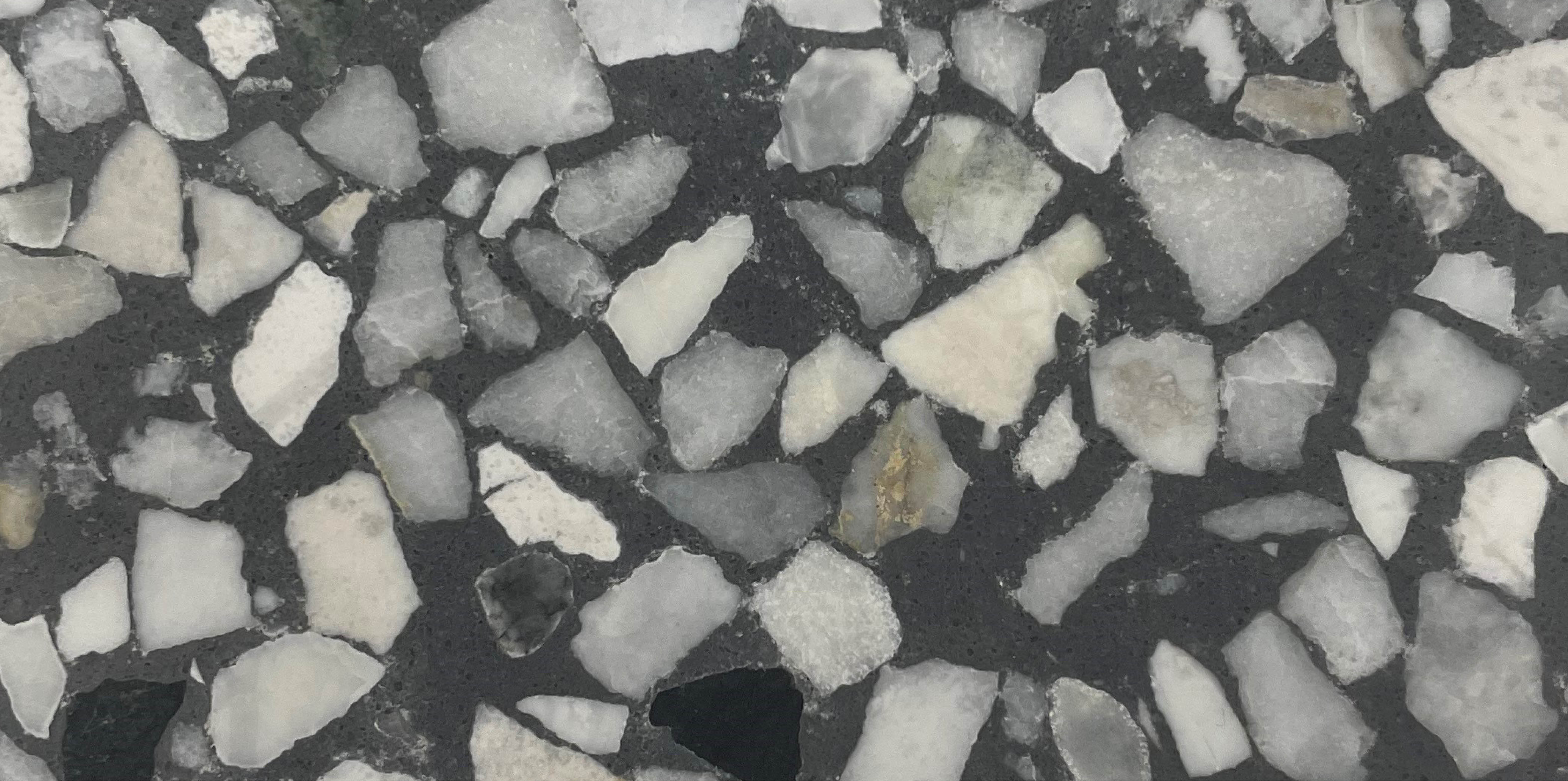 Close up of a grey British Terrazzo tile