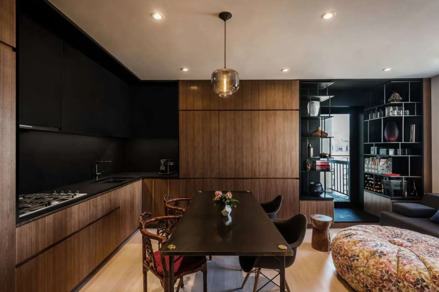 A dark toned kitchen with PaperStone® slate surfaces
