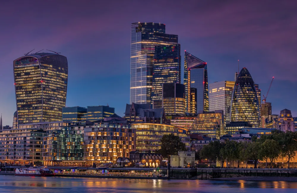 London City's twilight skyline with the Thames River and the illuminated skyscrapers