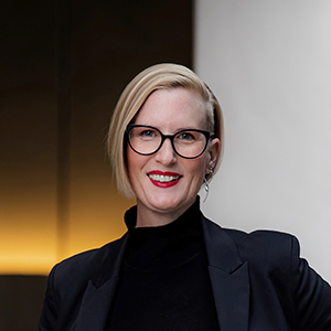 Nikki Paton smiling at the camera wearing a black top