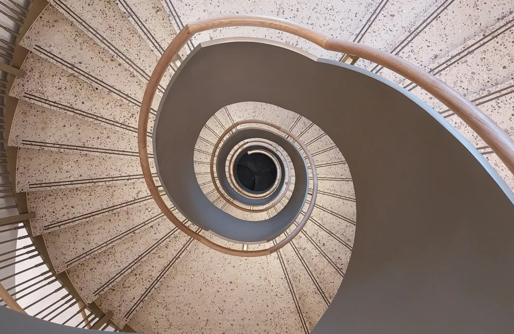 Looking down the centre of a spiral staircase