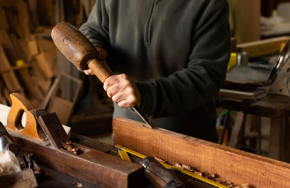 Close up of a carpenter working with wood