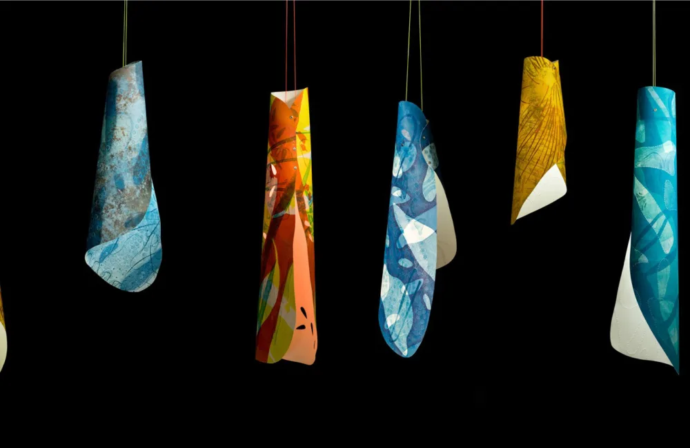 Rachel Lee's Chrysalis series 1-7, illuminated and photographed against a black background