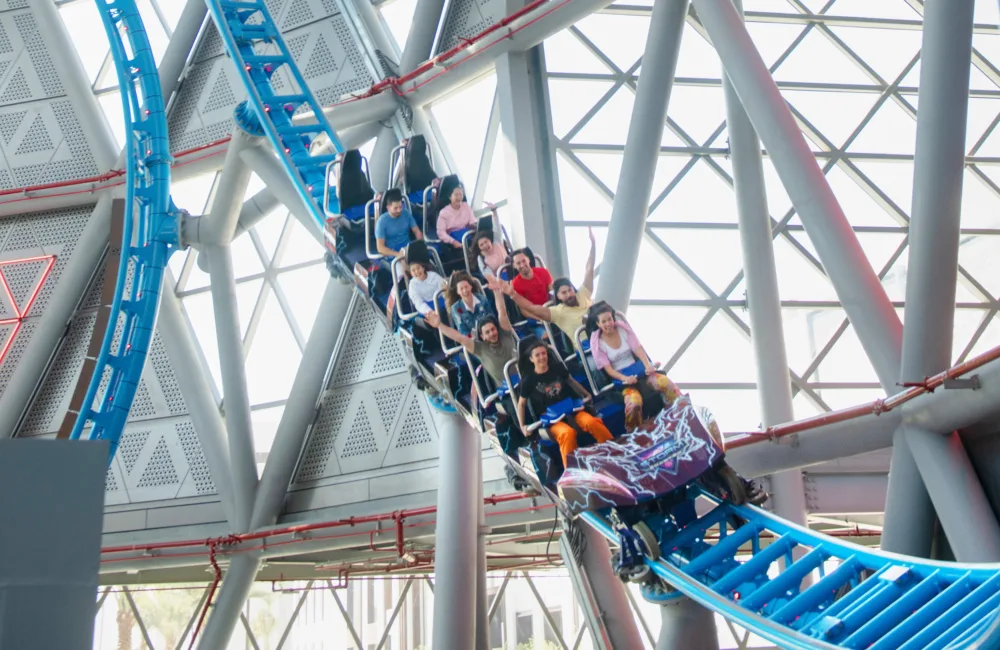 People enjoying The Storm roller coaster ride