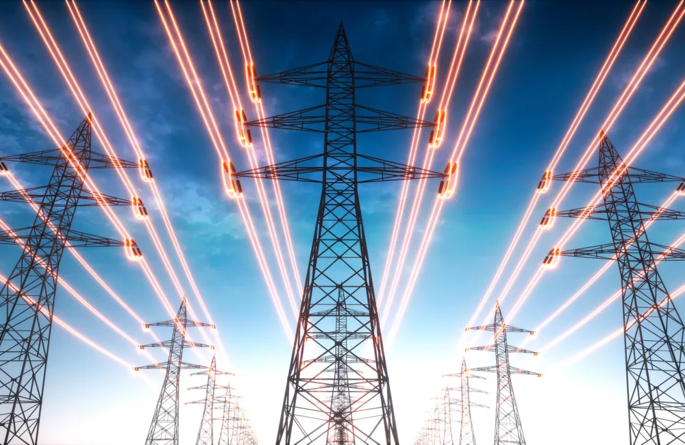 3 lines of electricity pylons with glowing wires