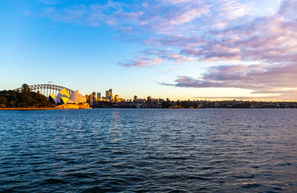Sydney skyline at sunrise overlooking famous building and bridge in Sydney Australia