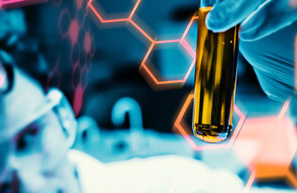 close up of man holding test tube