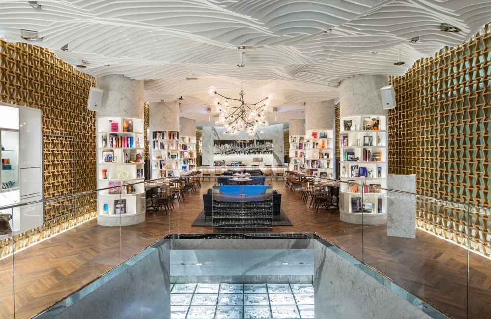Panorama of a seating surrounded by bookshelves