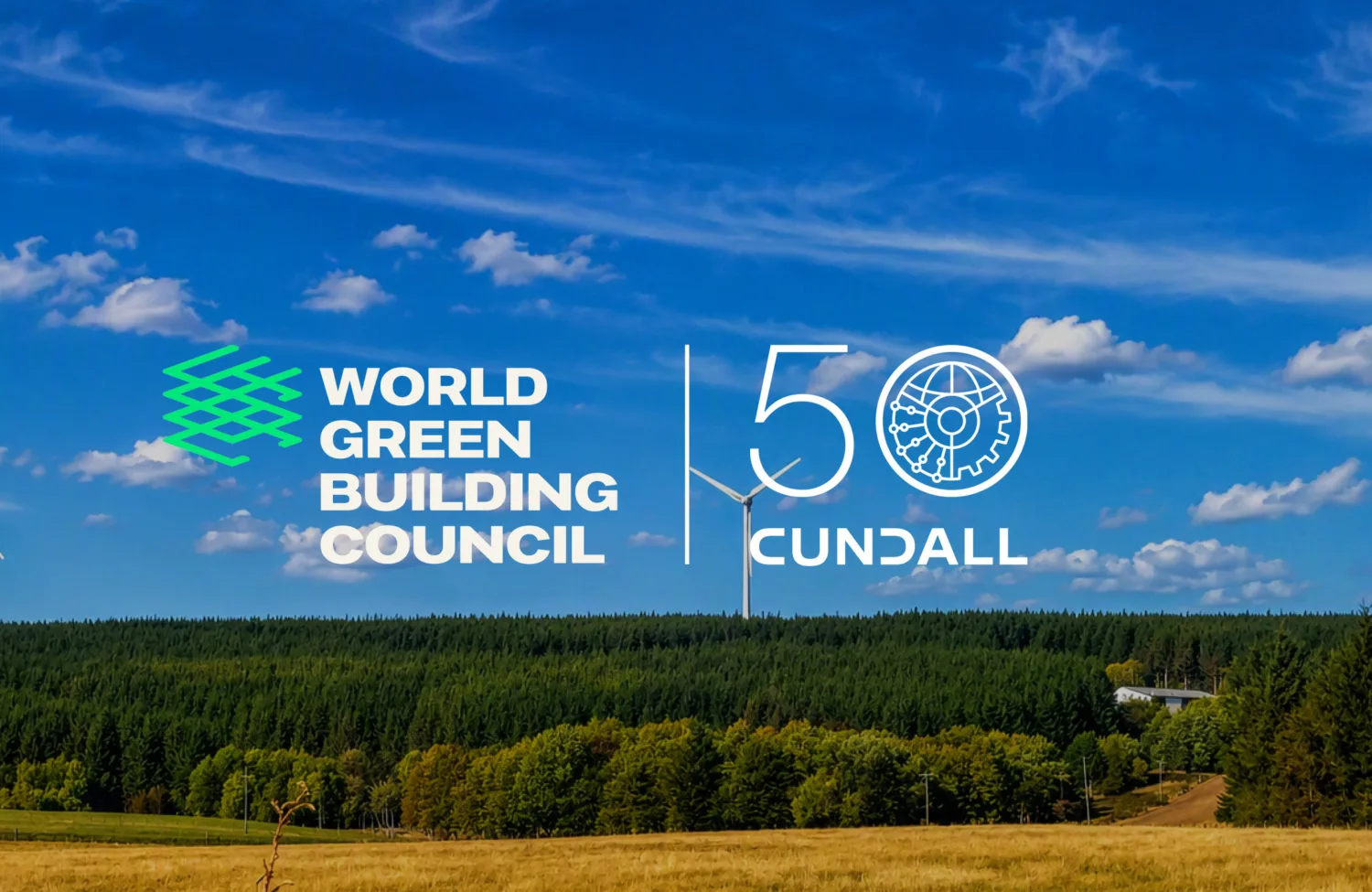 World Green Building Council and Cundall 50th anniversary logos over a landscape with wind turbines, forest and blue sky.
