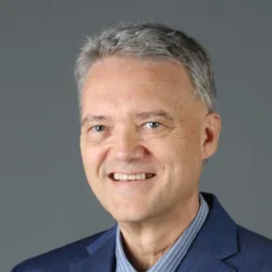 Randy Durband portrait with dark grey background