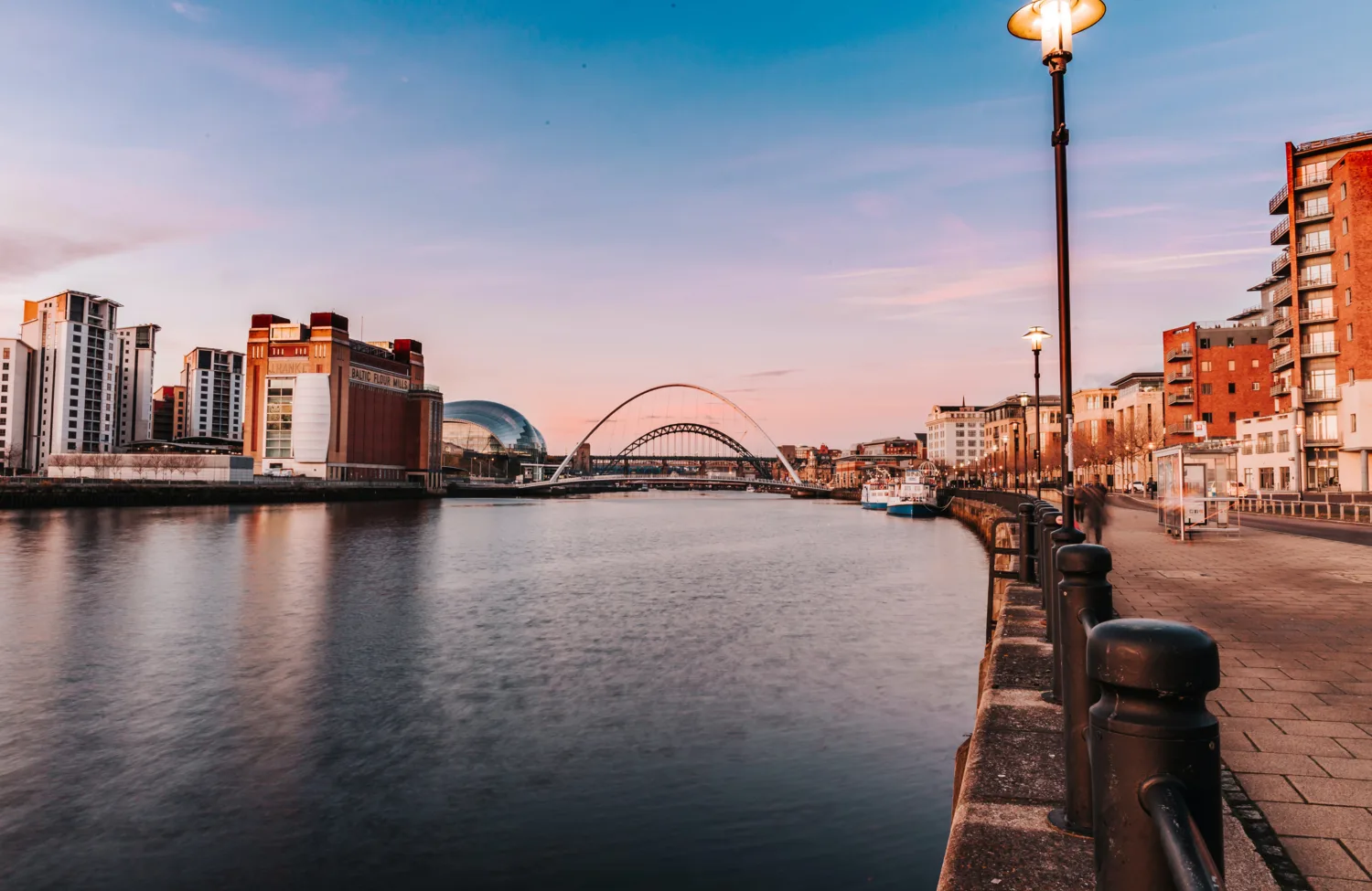 Sunset view of the Tyne River with bridges in background