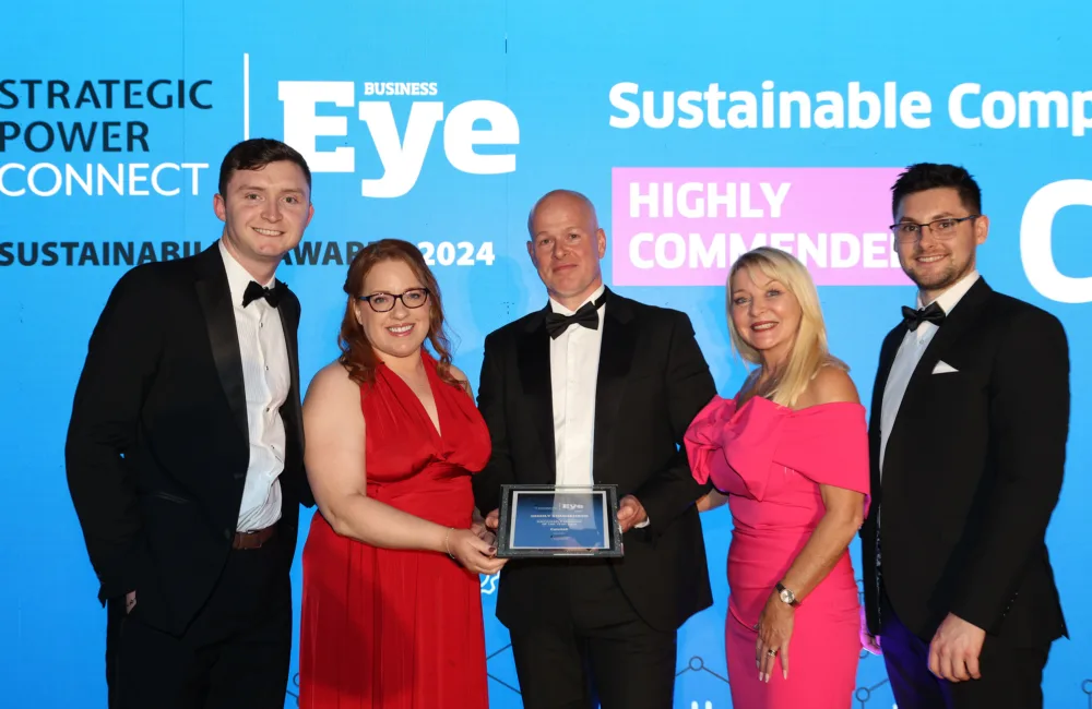 Cundall colleagues posing for a photo holding the highly commended in Business Eye Sustainability award