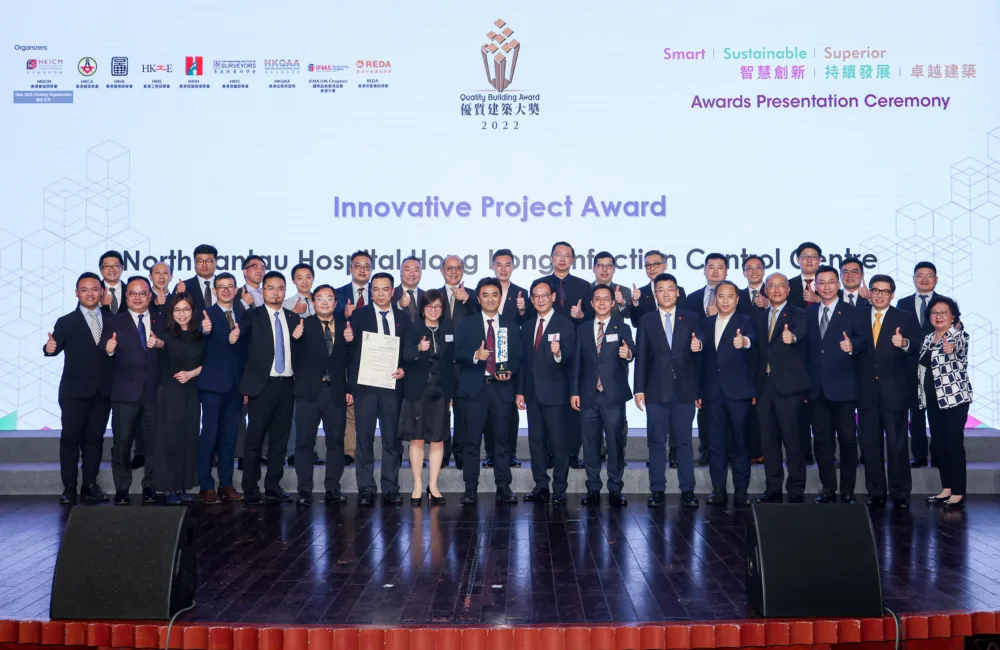 Award winning delegates standing on stage with certificate