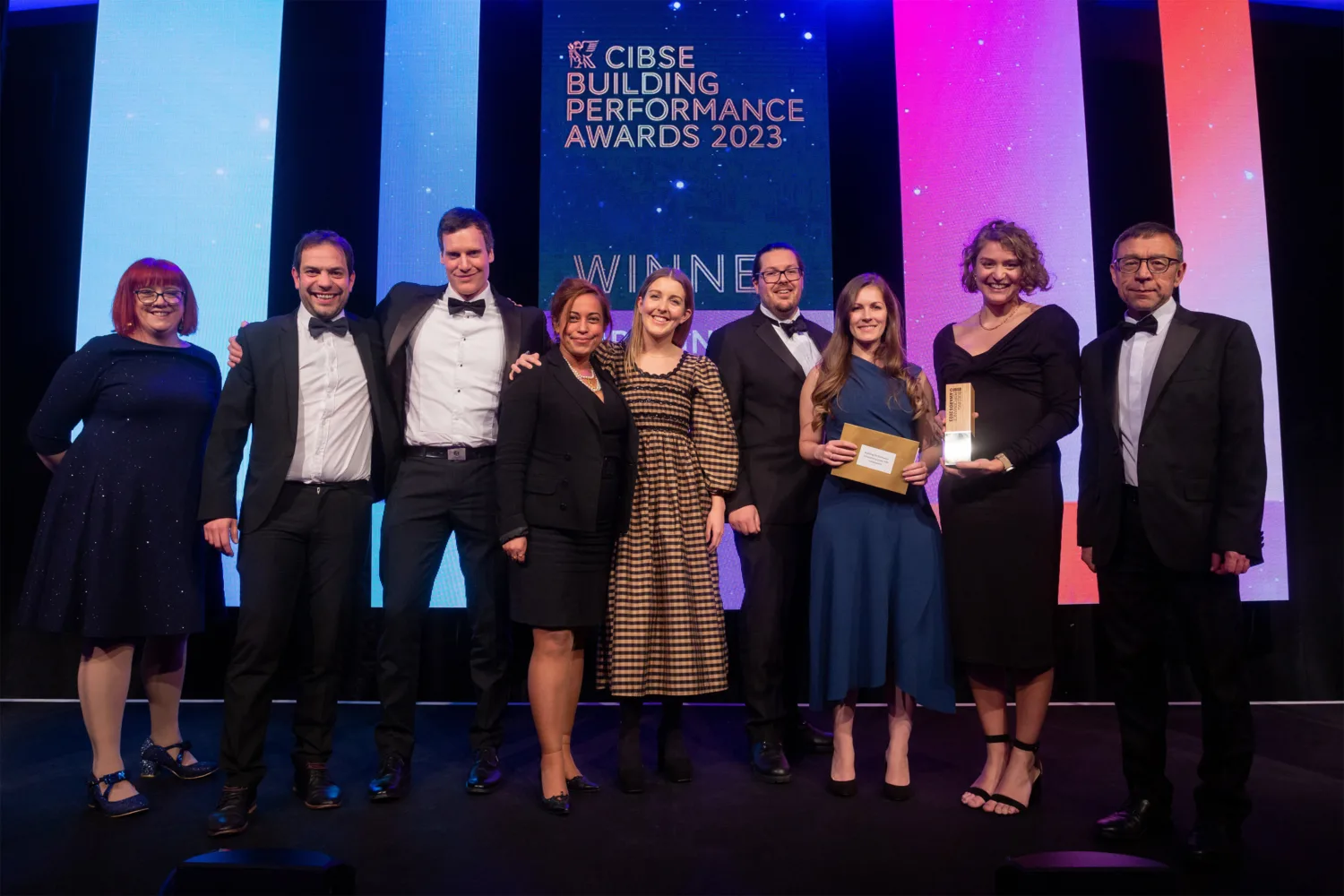Cundall team members on stage collecting their award for Consultant of the year over 300