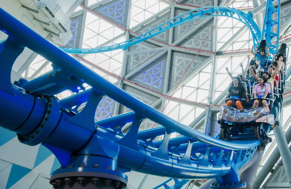 People enjoying one of the loops of The Storm coaster.