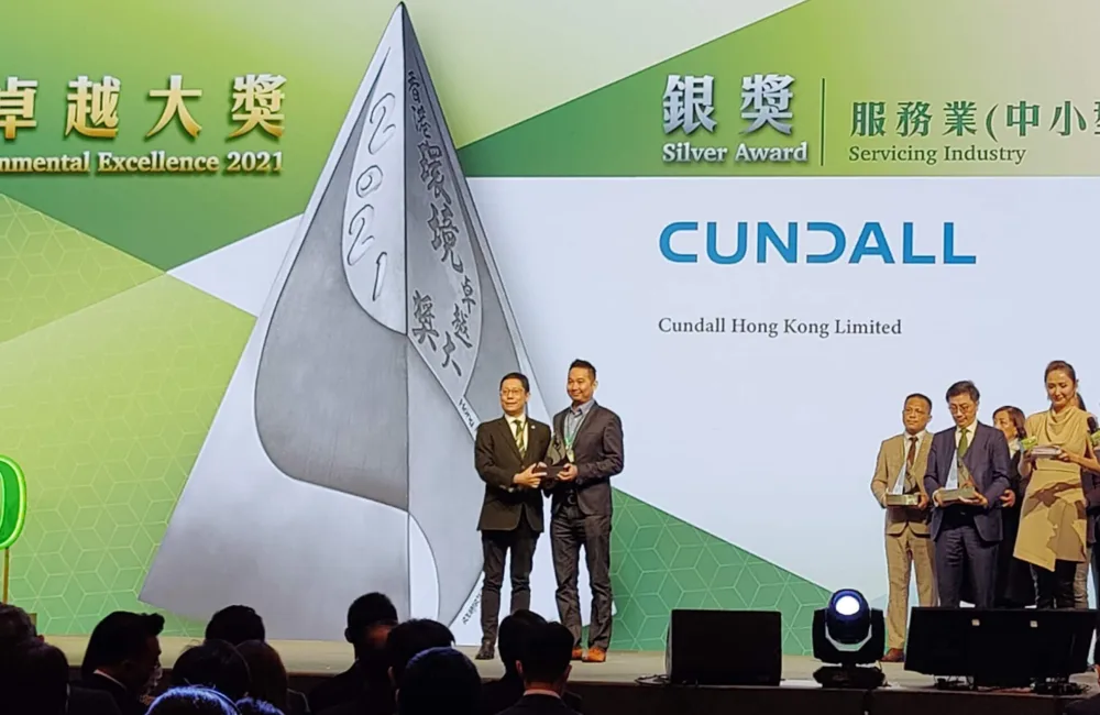Joe Tang receiving the award on stage.
