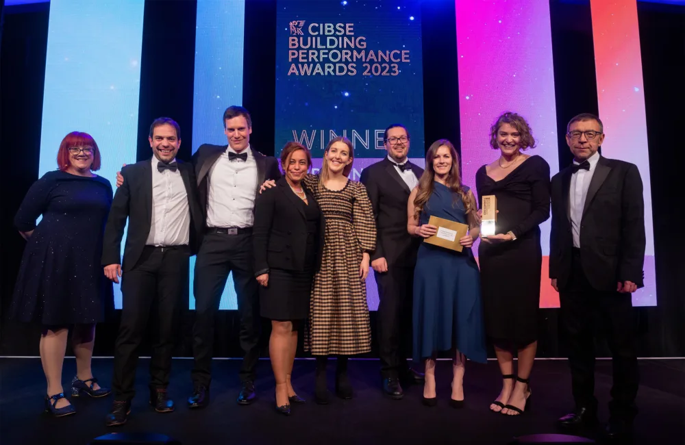 Cundall team members on stage collecting their award for Consultant of the year over 300