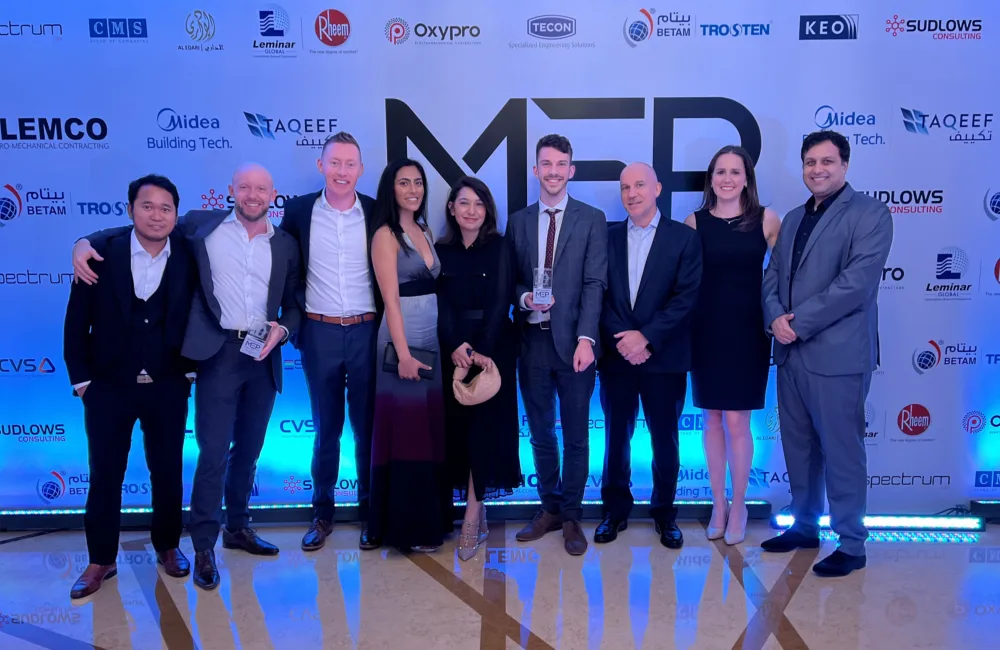 The Cundall Dubai MEP team posing for a photoshoot in a construction and engineering event in the region.