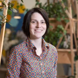 Kirsty Hogg standing in the lobby space of an office