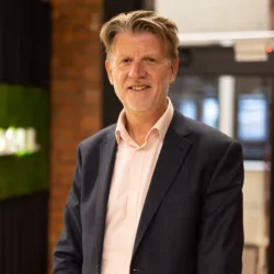 Paul Kenyon with office background