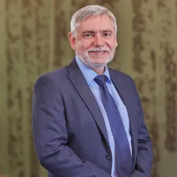 Paul Hards in front of glass bamboo effect panelling