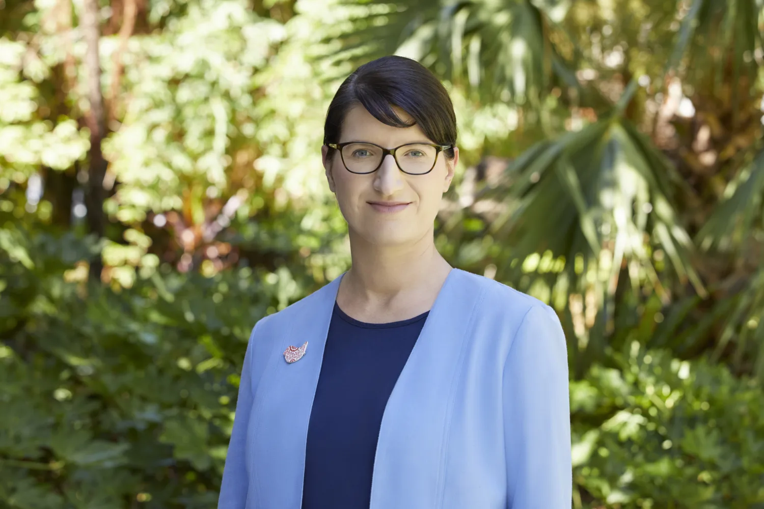 Madlen Jannaschk in blue jacket and navy top with planting background