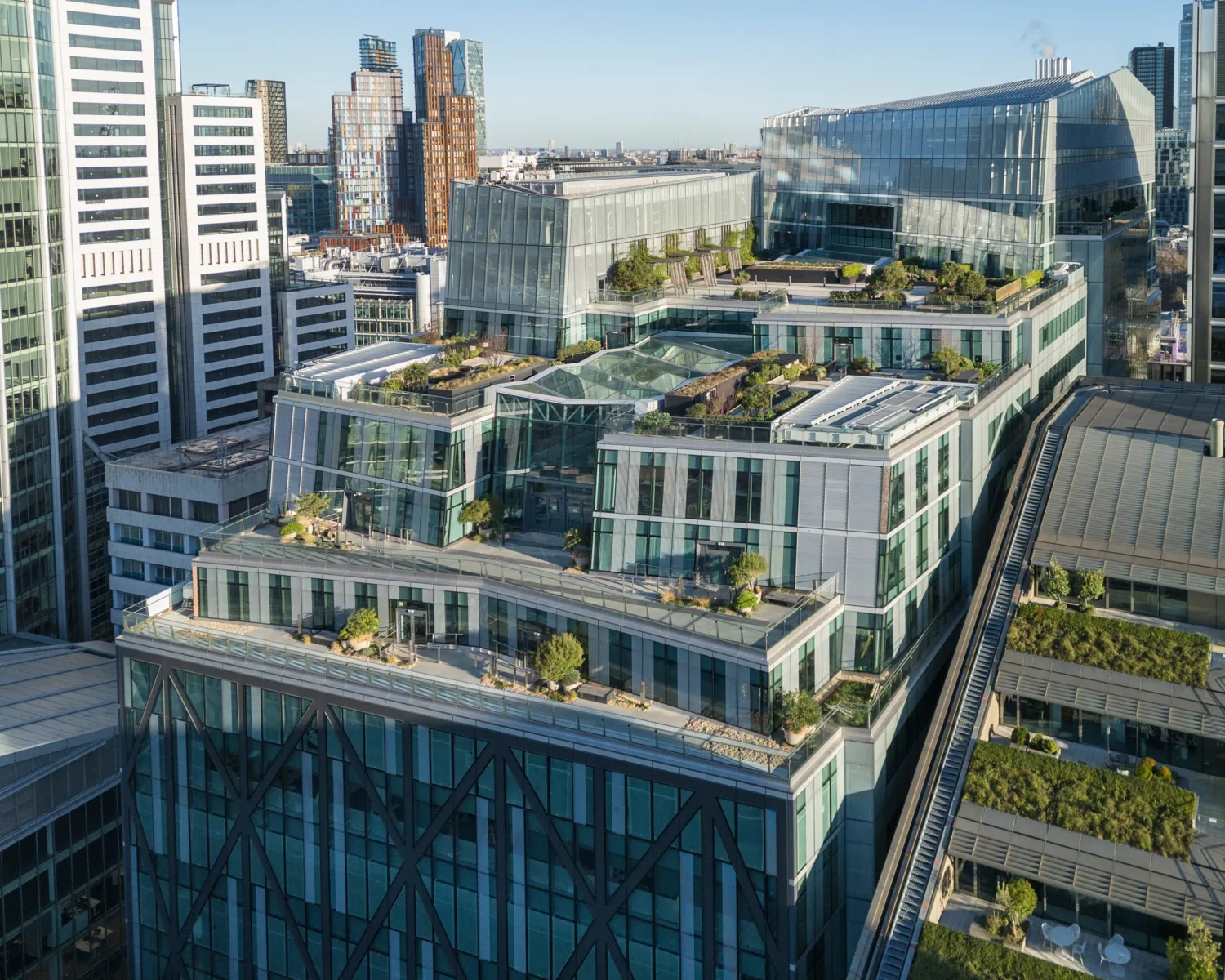 21 Moorfields roof top taken from facing room top with grass planting and trees with London skyline in background