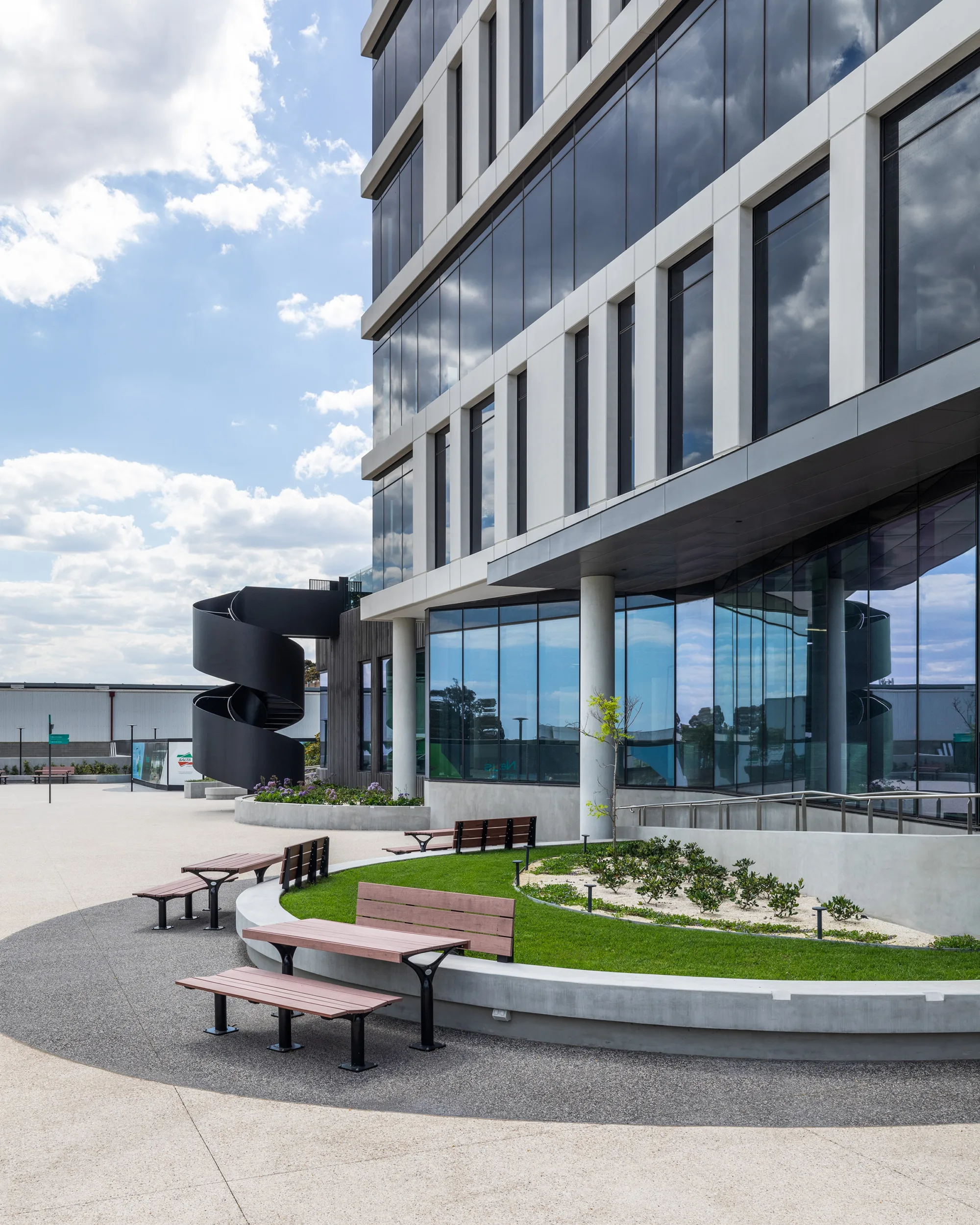 outdoor bench seating area next to office entrance