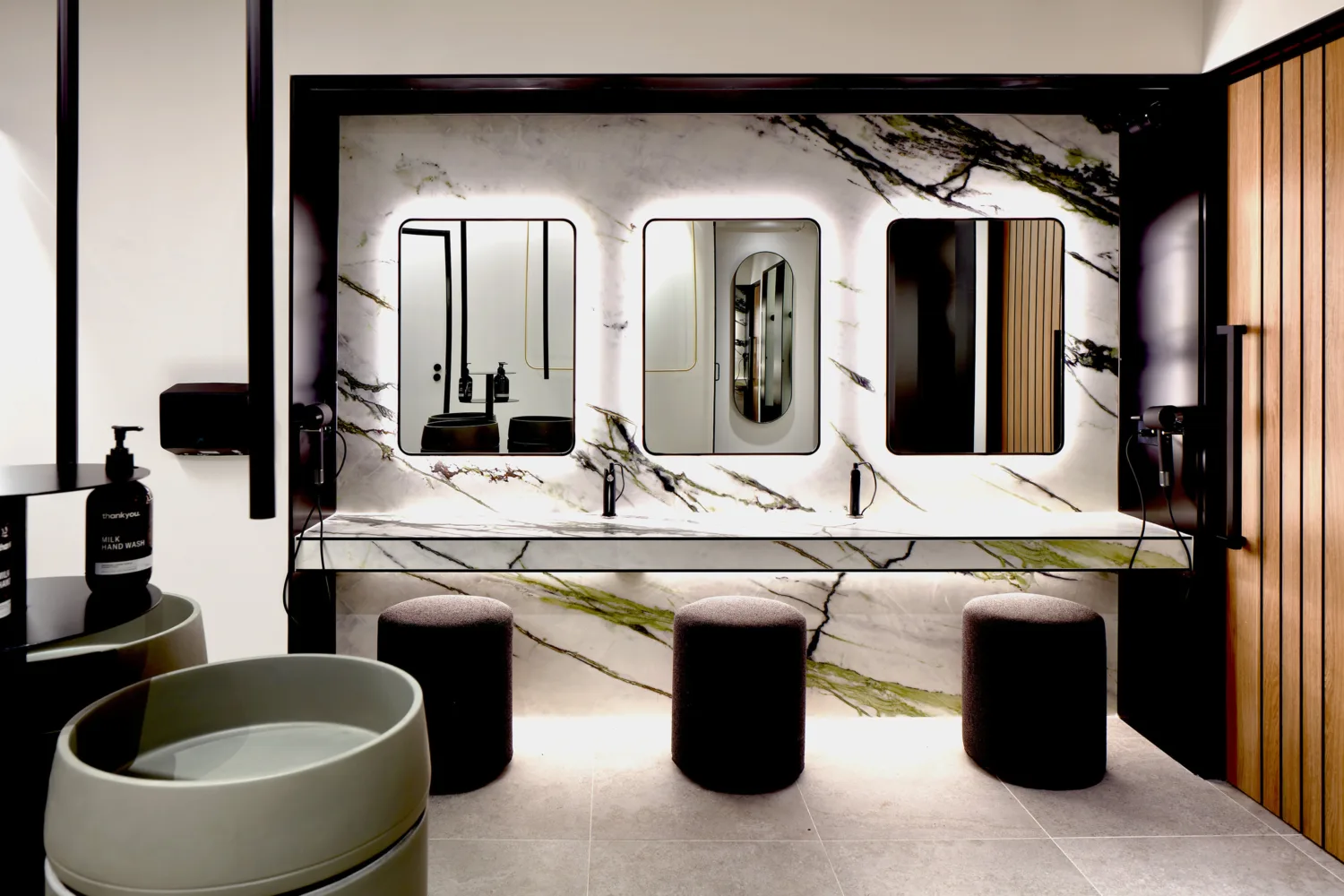 Mirrored vanity area in changing room facilities.