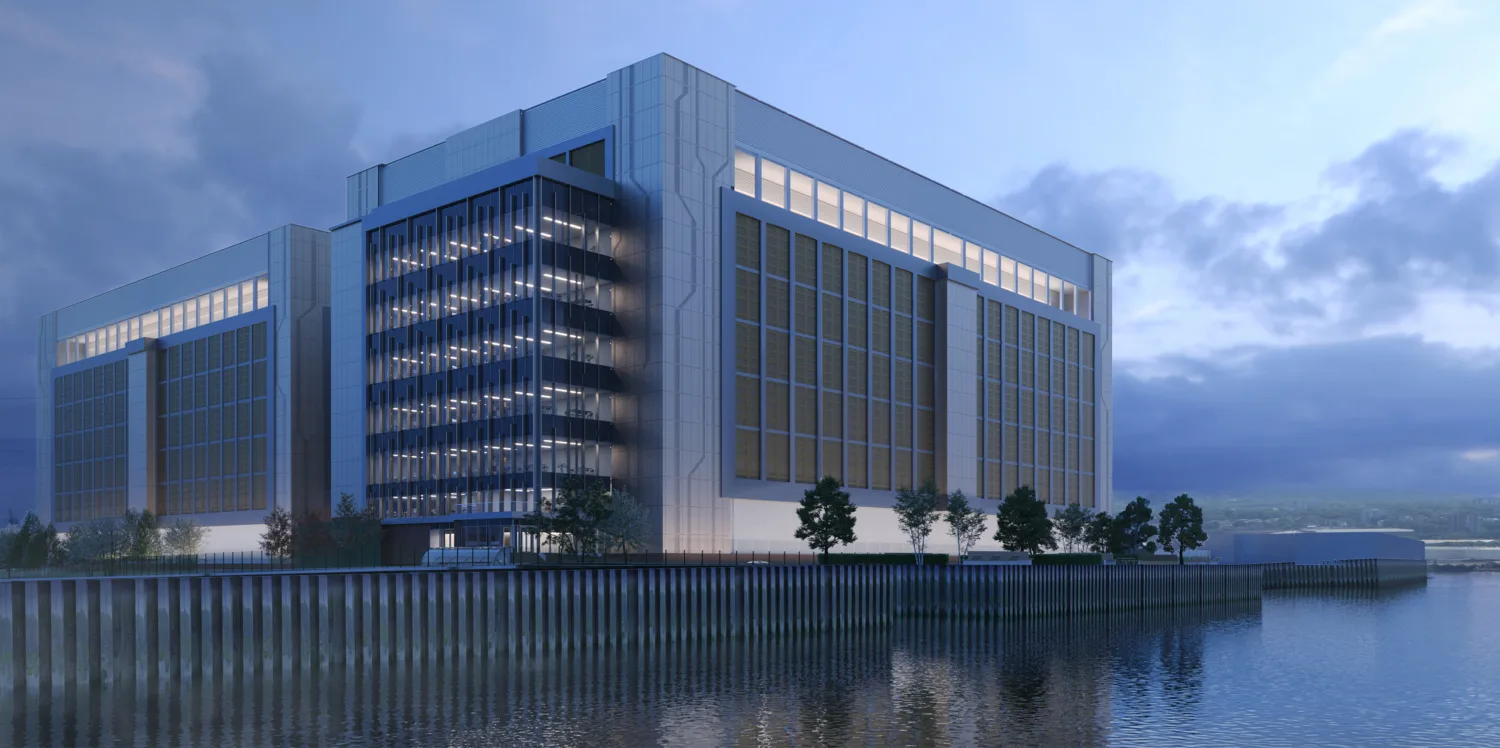 Evening view of Ada Infrastructures Docklands Data Centre from the water
