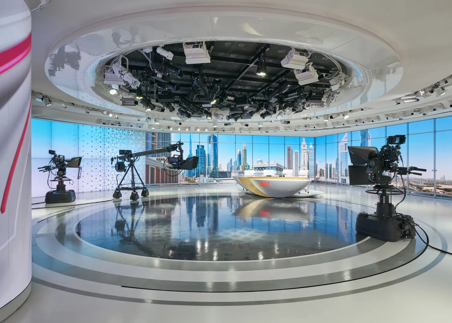 Broadcast Studio Set for news anchors with high-end cameras surrounding the center table at Ashraq News Services Dubai