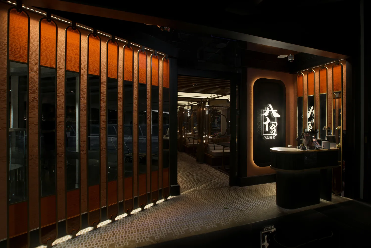 An inviting entrance with elegant glass door and warmly illuminated interior