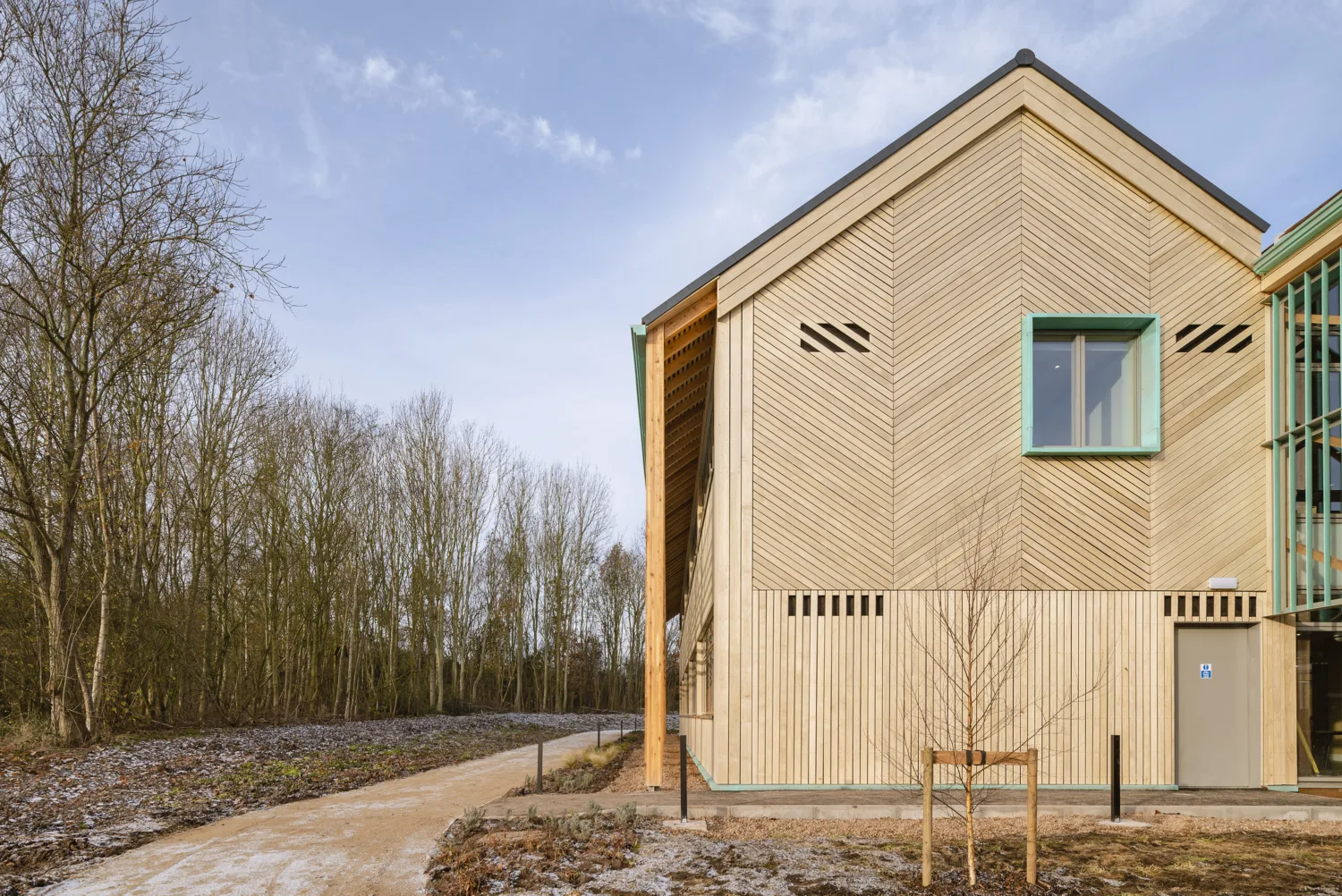 External shot of building showing timber against a blue sky