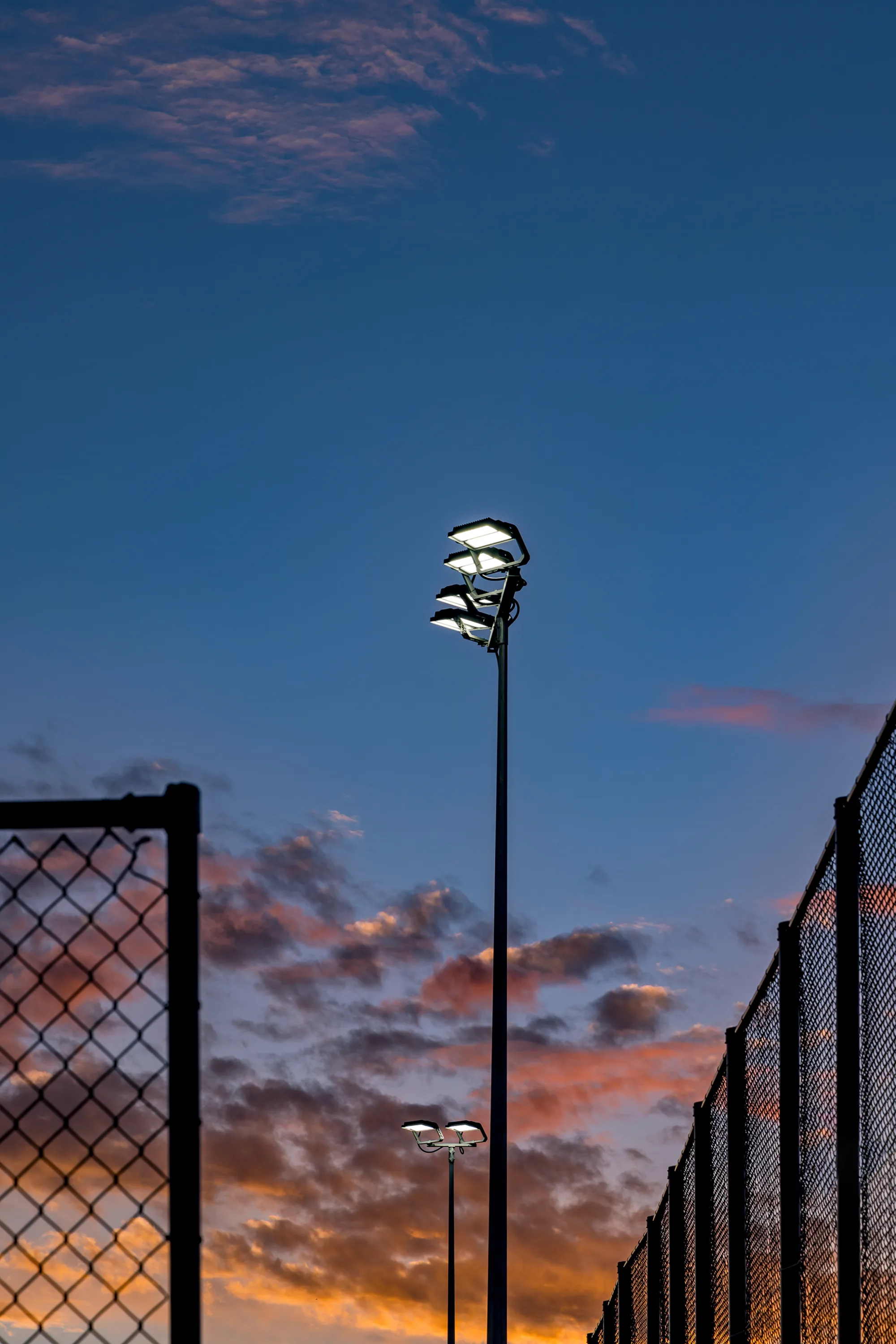Floodlights with Sunset sky in background