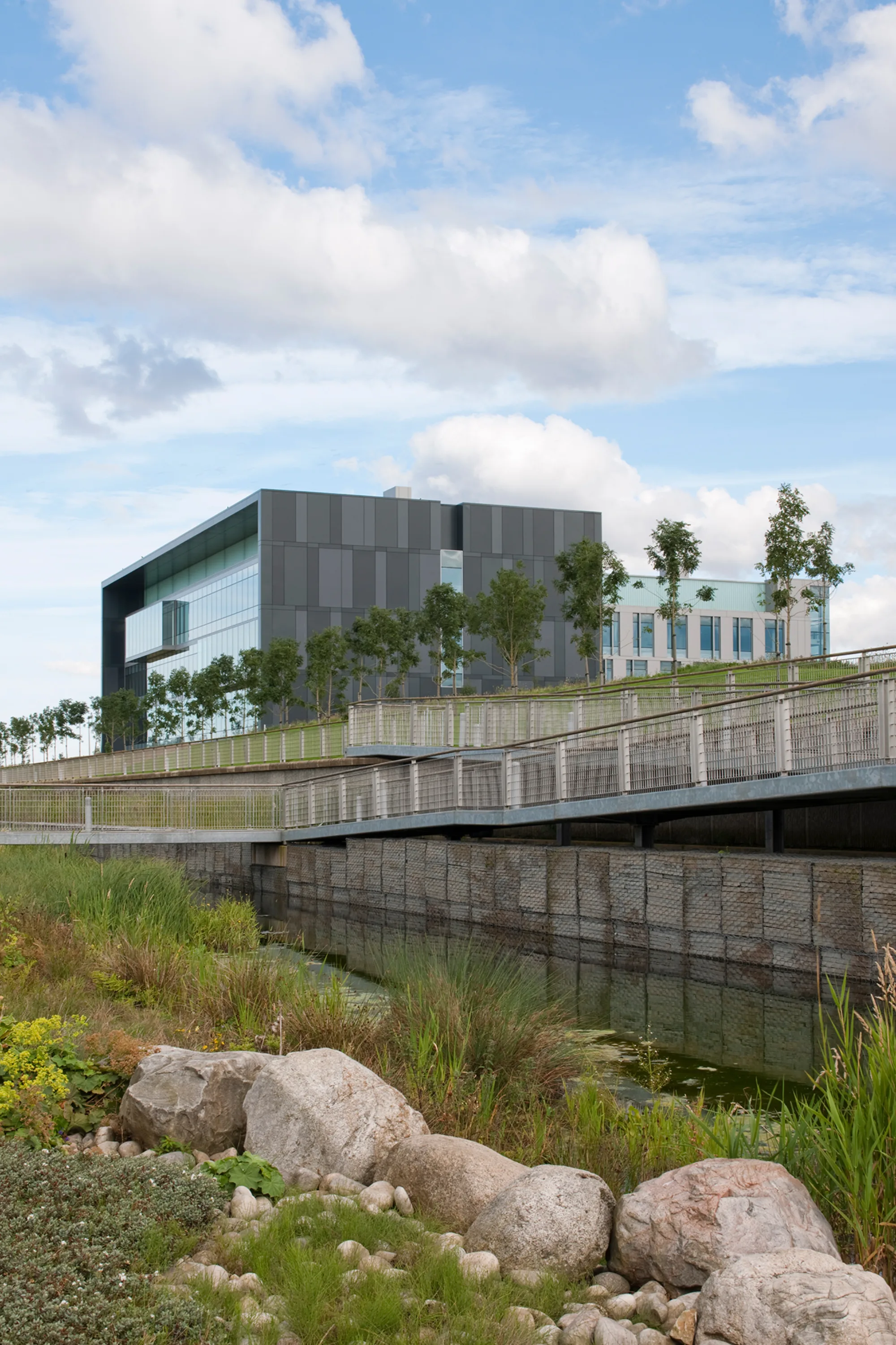 Edinburgh Bioquarter building with trees and river in front