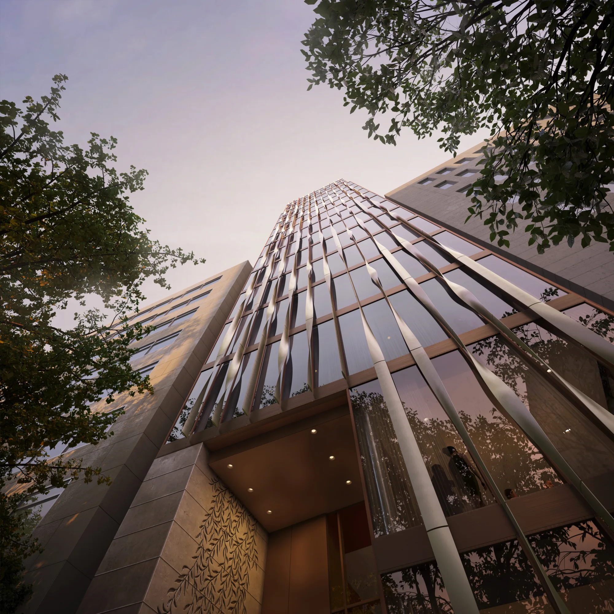 View from the ground of the front of the building showing a curved façade design and some internal features