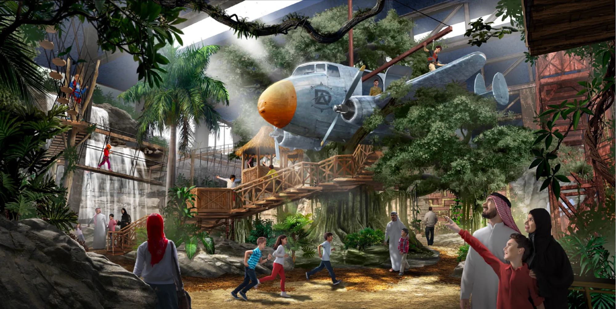 Interior of the discovery adventure centre showing wooden walkways, greenery, and a waterfall on the left side