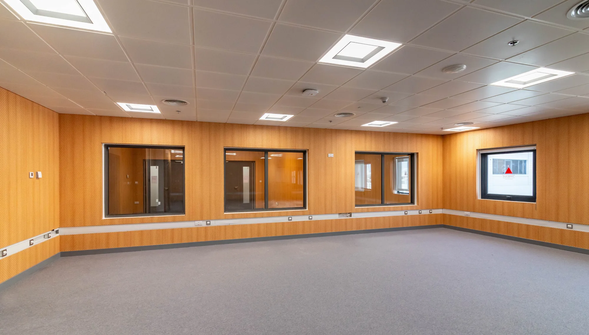 Doha College empty wooden room with acoustic padding on the walls