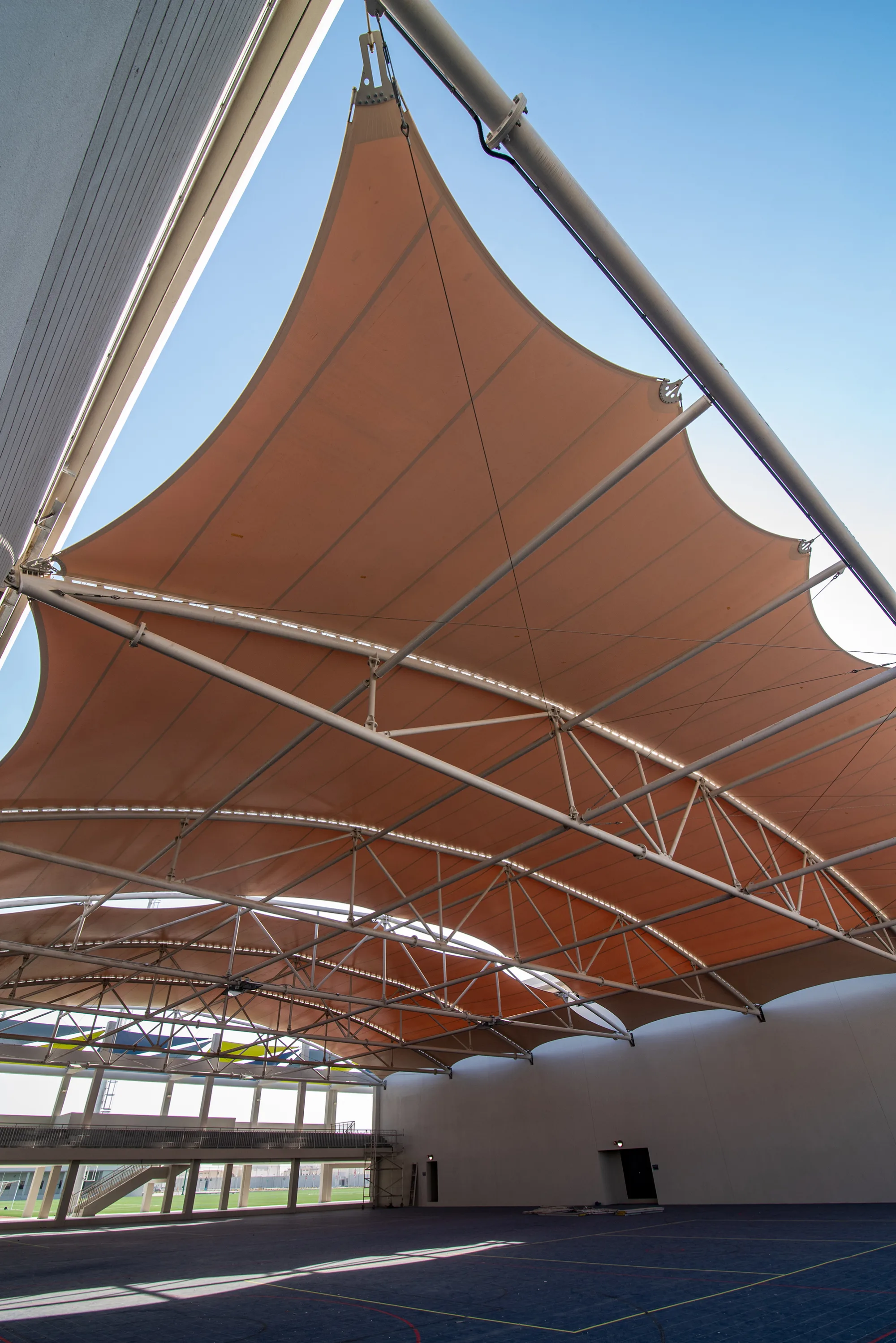 Doha College open area with badminton court and shade made out of tarpauline