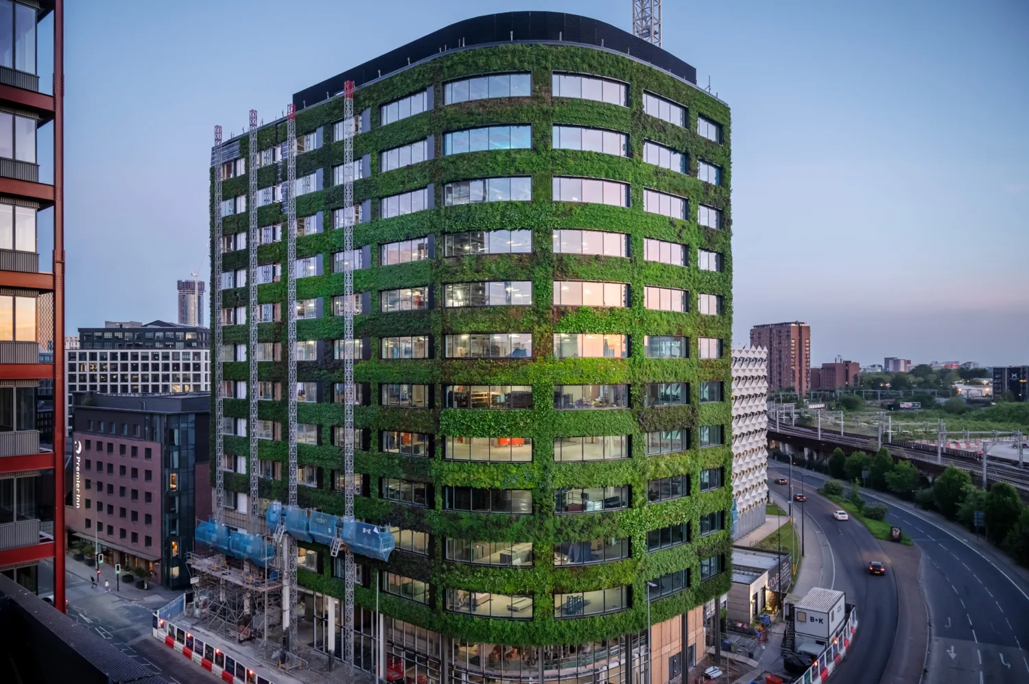 Shot of entire building with road either side against a dusky sky
