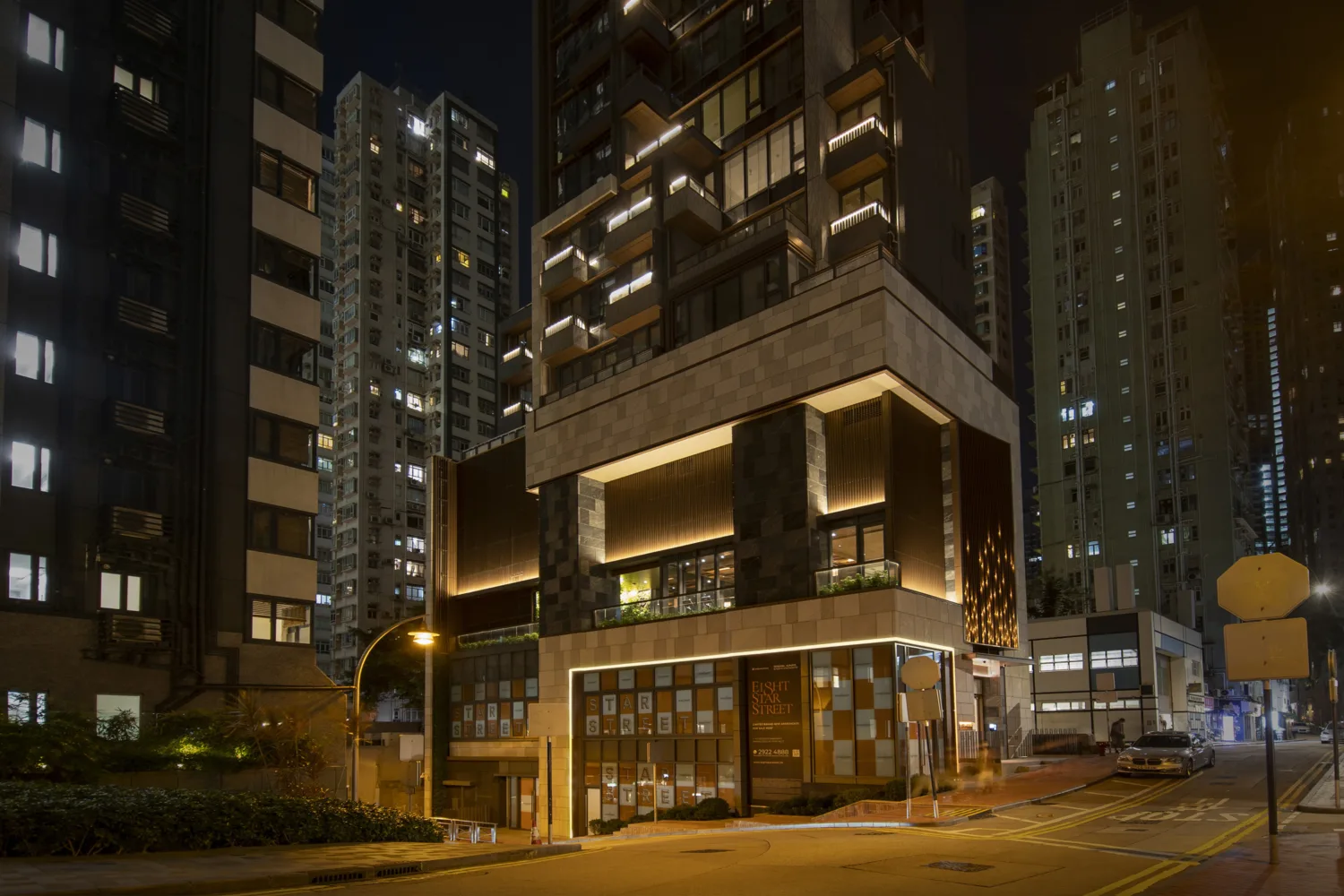 Night external view of building featuring interior and façade lighting.