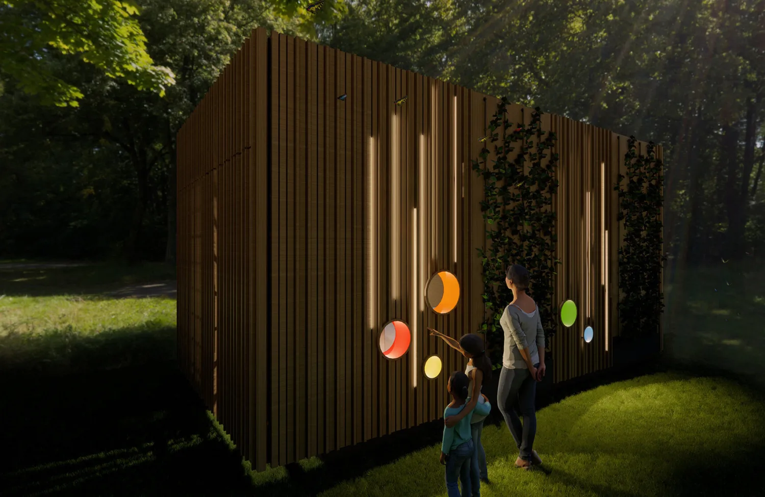 The pod at night in a park setting with children and adult looking at it all in 3D