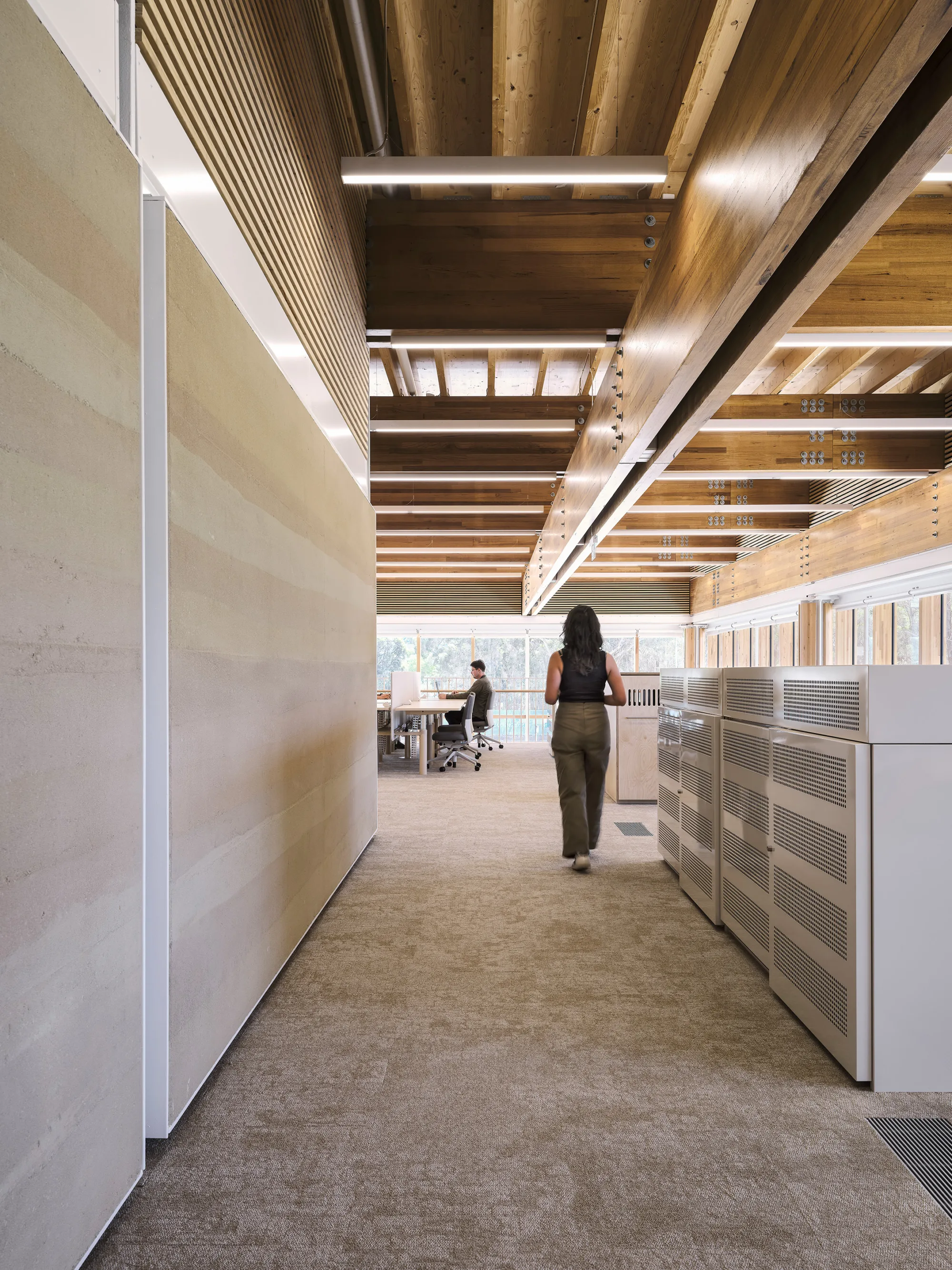 Person walking through an office environment