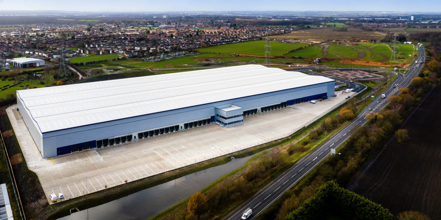 Aerial view of Gateway 4 an industrial unit surrounded by fields, houses and roads
