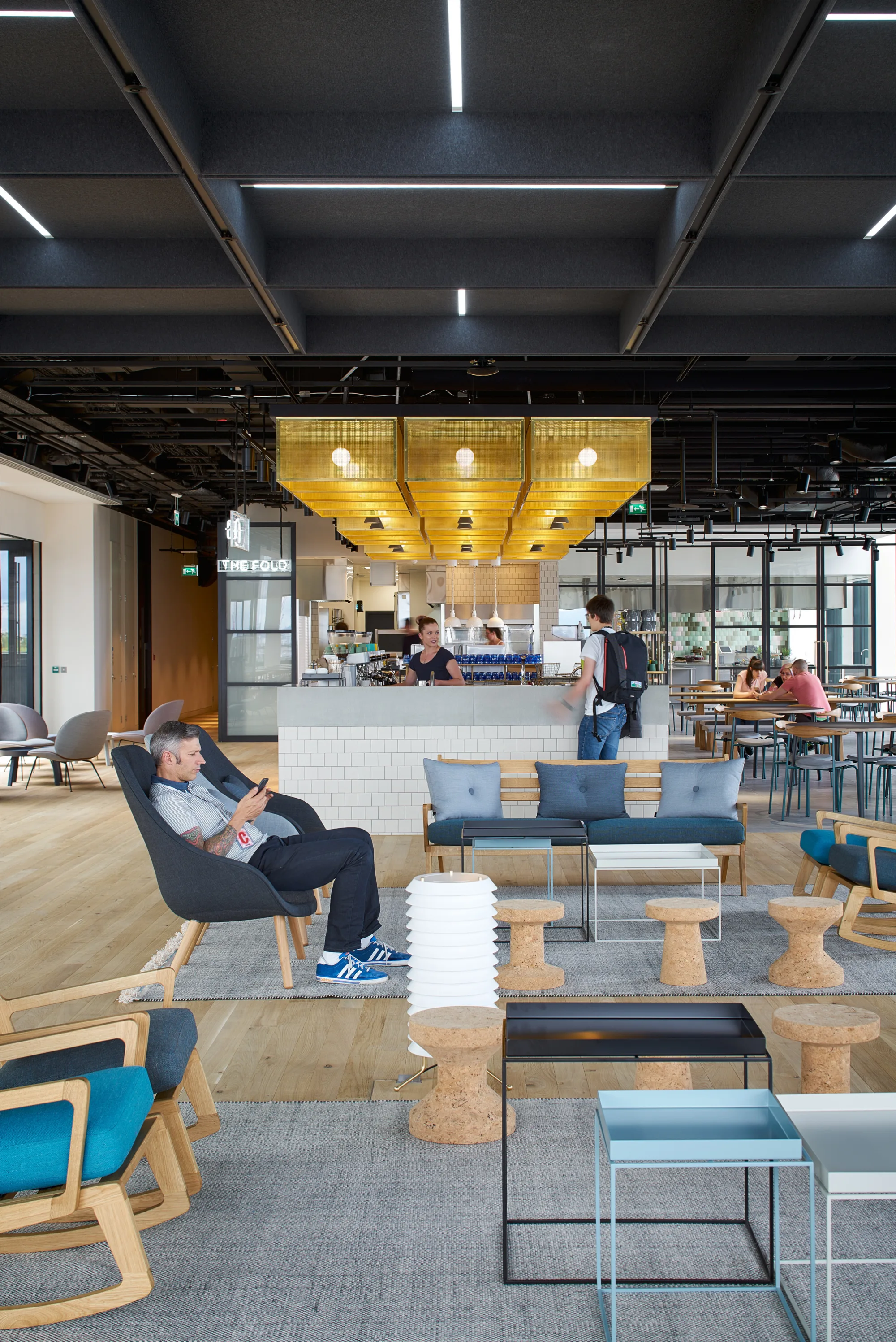 Open plan area with comfortable chairs and coffee bar