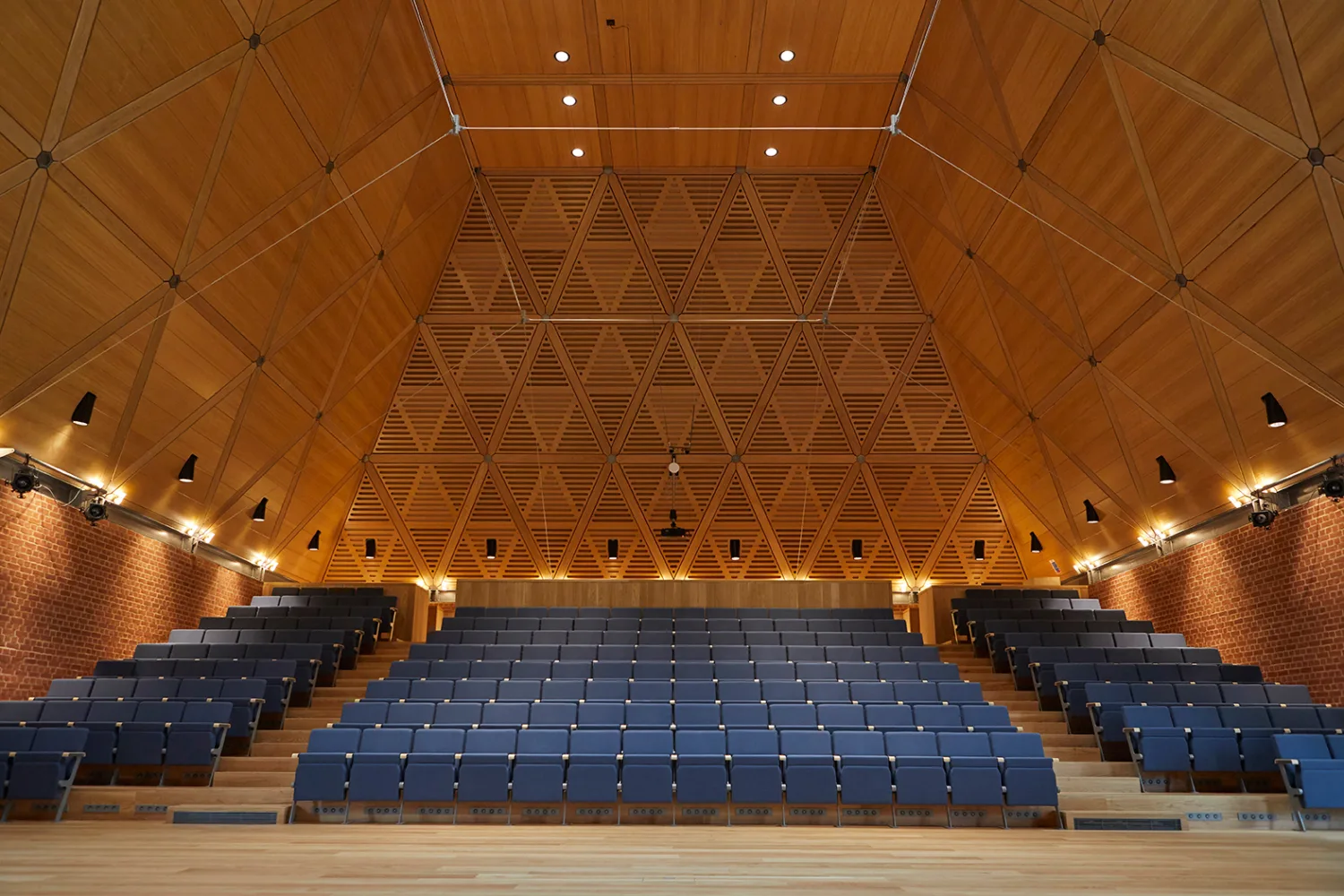 Blue theatre style seating in the timber music auditorium