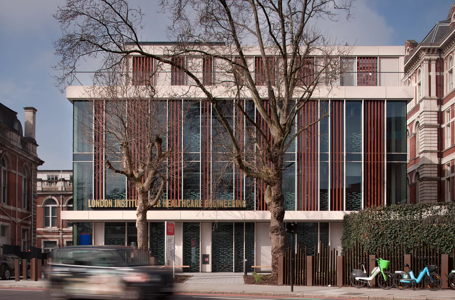 London Institute of Healthcare Engineering building entrance in the day with trees in front